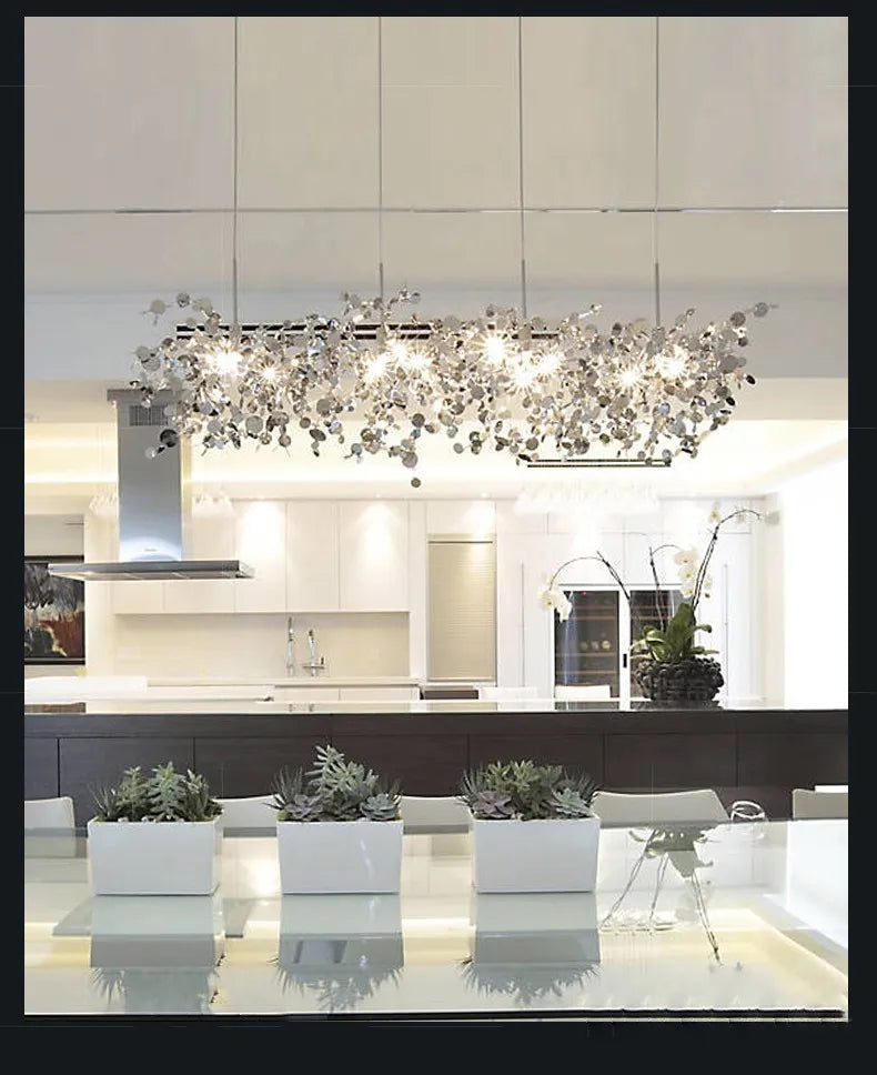 High-quality stainless steel Aurora chandelier with G9 light sources, available in Golden and Chrome finishes. Perfect for living rooms, dining rooms, bedrooms, villas, and lobbies, this versatile design blends luxury and functionality for a brilliant and inviting ambiance.