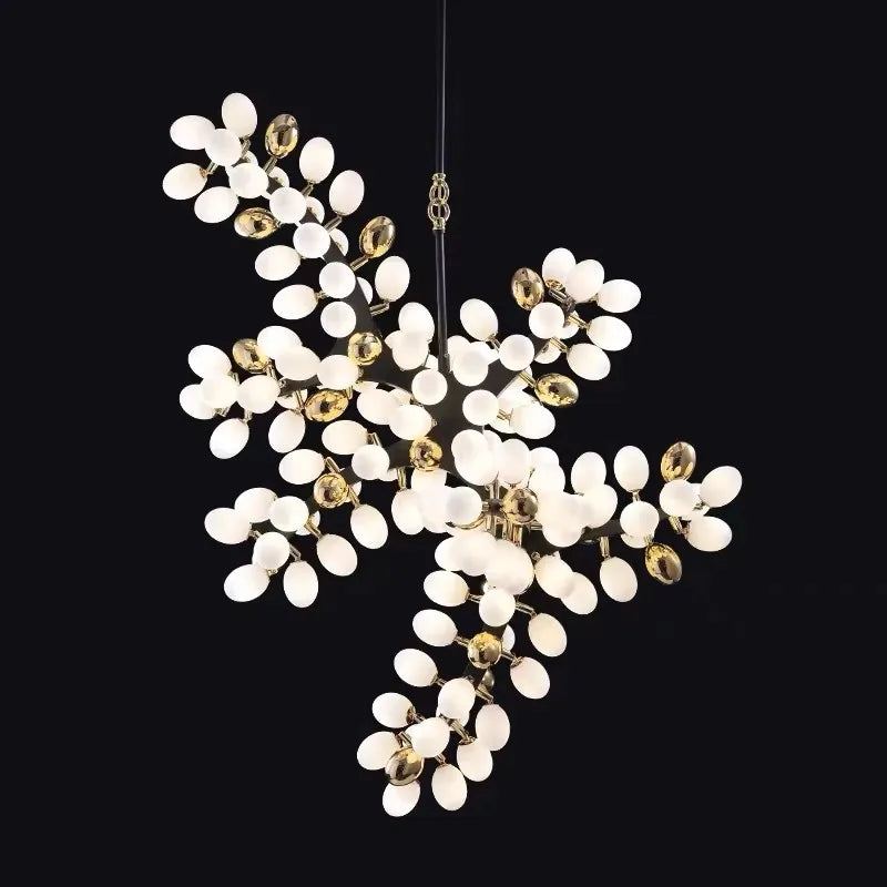 Vynelle chandelier with black and French gold egg-shaped glass design creating warm ambient luxury lighting
